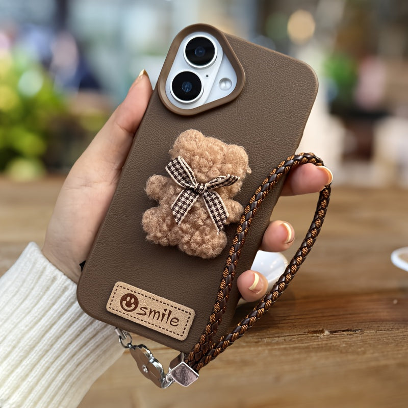 A Single-Pack Plush Teddy Bear Phone Case with a Bow, Available in White And Brown. It Comes with a Wrist Strap And Features a Simple And Elegant Faux Leather Texture That Is Anti-Slip And Fingerprint-Resistant. Made with TPU